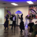 Performers Dancing with Second Line Umbrellas